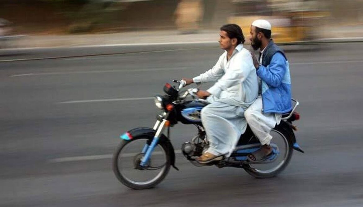Pillion riding banned across Sindh on Muharram 9, 10 The undated image shows two men riding a motorcycle. — PPI/File