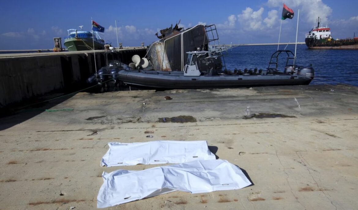 Bags containing a body of two migrants, who died after a boat sank off the coast, lay in a navy base in Tripoli, Libya, December 21, 2015. — Reuters