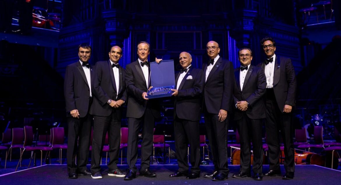 Former UK prime minister Lord David Cameron (centre-left) gives an award to Bestway Group founder, Sir Anwar Pervez OBE (centre-right), during the celebration of the 50th anniversary of Bestway Group at the Royal Albert Hall, London, Britain. — Reporter