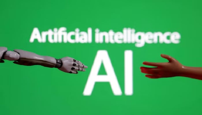 AI assistants distort news in nearly half their responses, EBU–BBC Words reading Artificial intelligence AI, miniature of robot and toy hand are pictured in this illustration taken December 14, 2023. — Reuters
