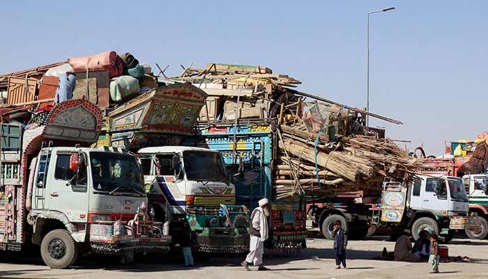 Afghan transit trade all set to resume in phases, says A man walks near children next to parked vehicles loaded with the belongings of Afghan citizens attempting to return to their country, after Pakistan closed border crossings with Afghanistan following exchanges of fire between the nations forces, at the border crossing in Chaman, Balochistan, October 16, 2025. — Reuters