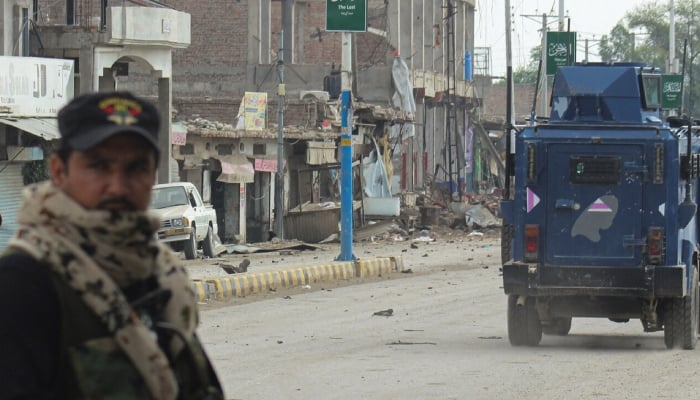 Centre, KP govt clash over bulletproof vehicles A police officer stands guard on a street in Bannu, Khyber Pakhtunkhwa, September 2, 2025. — Reuters