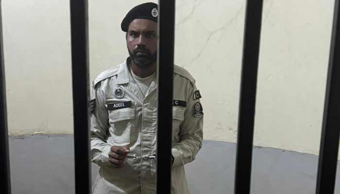 Cop arrested for harassing woman in Sargodha This image shows a cop, suspected of harassing a woman in a passenger bus, inside a jail. —X@MaryamNSharif