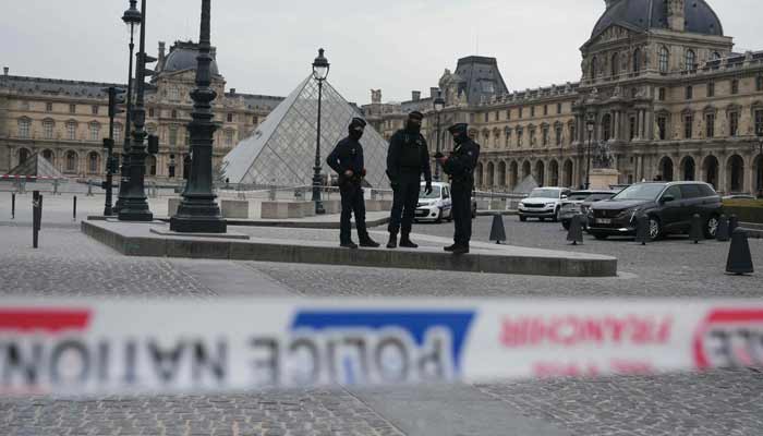 France intensifies hunt for Louvre raiders as museum security scrutinised French police officers patrol in front of the Louvre Museum after it was robbed, with the Louvre Pyramid designed by Ieoh Ming Pei in the background, in Paris on October 19, 2025.— AFP