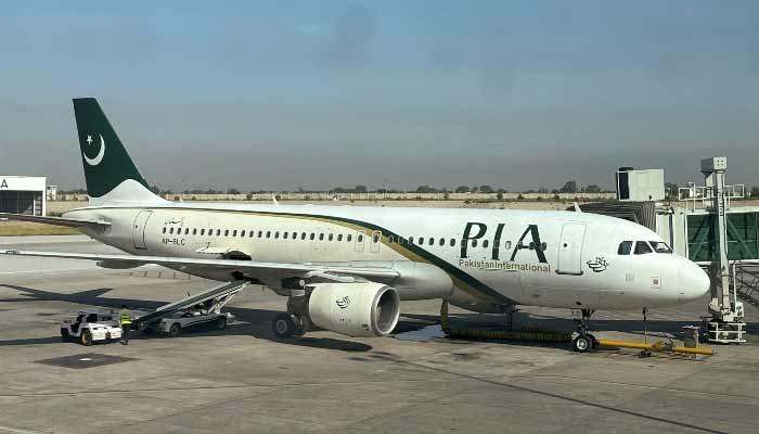 Govt ‘aims to finalise’ PIA privatisation by December View of a Pakistan International Airlines (PIA) passenger plane, taken through a glass panel, at Islamabad International Airport, October 3, 2023. — Reuters