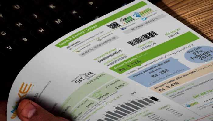 KE says Nepra tariff cut not applicable to consumer bills A person holds a bill in their hand. — KE
