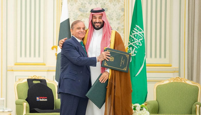 PM Shehbaz Sharif to visit Saudi Arabia next week to Saudi Crown Prince Mohammed bin Salman and Pakistan Prime Minister Shehbaz Sharif embrace each other on the day they sign a defence agreement, in Riyadh, Saudi Arabia, September 17, 2025. — Reuters