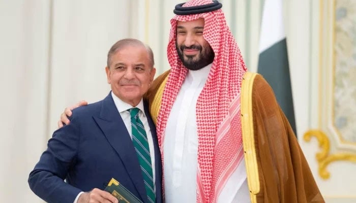 PM Shehbaz to visit Saudi Arabia tomorrow to attend Future Saudi Crown Prince Mohammed bin Salman and Pakistan Prime Minister Shehbaz Sharif embrace each other on the day they sign a defence agreement, in Riyadh, Saudi Arabia, September 17, 2025. — Reuters