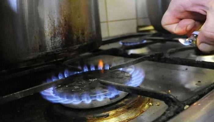 PM announces resumption of new gas connections after four-year ban A representational image of a person lighting a stove. — AFP/File