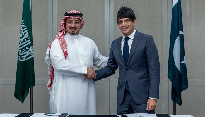 Pakistan, Saudi Arabia join hands to promote football development PFF President Mohsin Gilani (right) and SAFF President Yasser Al-Misehal shaking hands after signing agreement. — Reporter