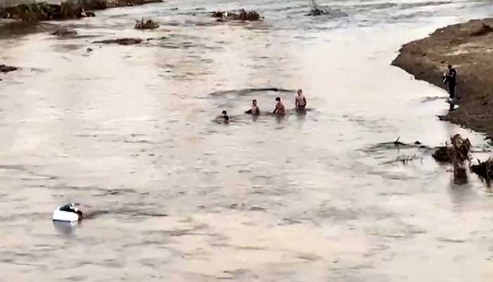 Pakistanis among hundreds flee to Thailand after Myanmar scam centre This screengrab from Thai PBS video footage taken in Mae Sot on October 22, 2025 and received by AFPTV on October 23, 2025 shows people crossing a section of the Moei river near KK Park in Myanmar (R) to Thailand. — AFP