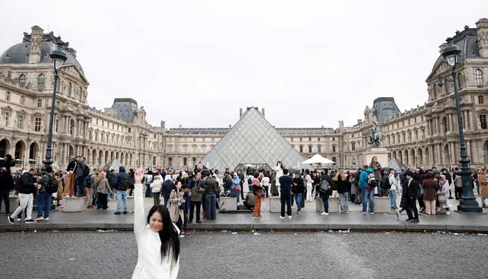 Two suspects arrested in Louvre jewel heist People stand near the glass Pyramid of the Louvre Museum as the museum remains closed the day after a spectacular jewel heist in Paris, France, October 20, 2025.— Reuters