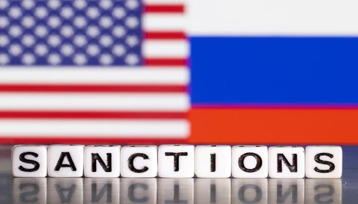 US mulls new Russia sanctions, urges Europe to ramp up Plastic letters arranged to read Sanctions are placed in front of the flag colours of the US and Russia in this illustration taken February 28, 2022. — Reuters