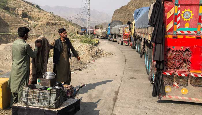 hope for peace on Afghan-Pakistan border A tea vendor stands near the stalled vehicles near the closed Pakistan-Afghanistan border town of Torkham on October 19, 2025, after cross-border clashes between the two countries. — AFP