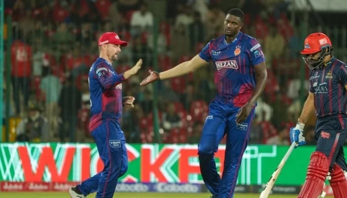 Islamabad Uniteds Jason Holder (centre) celebrates with Colin Munro after dismissing Karachi Kings Aamir Jamal during their PSL 10 match at the National Bank Stadium, Karachi, April 20, 2025. — PCB