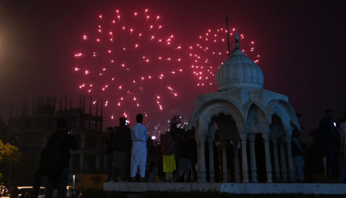 Revellers watch fireworks during the New Year celebrations in Karachi on January 1, 2026. — AFP