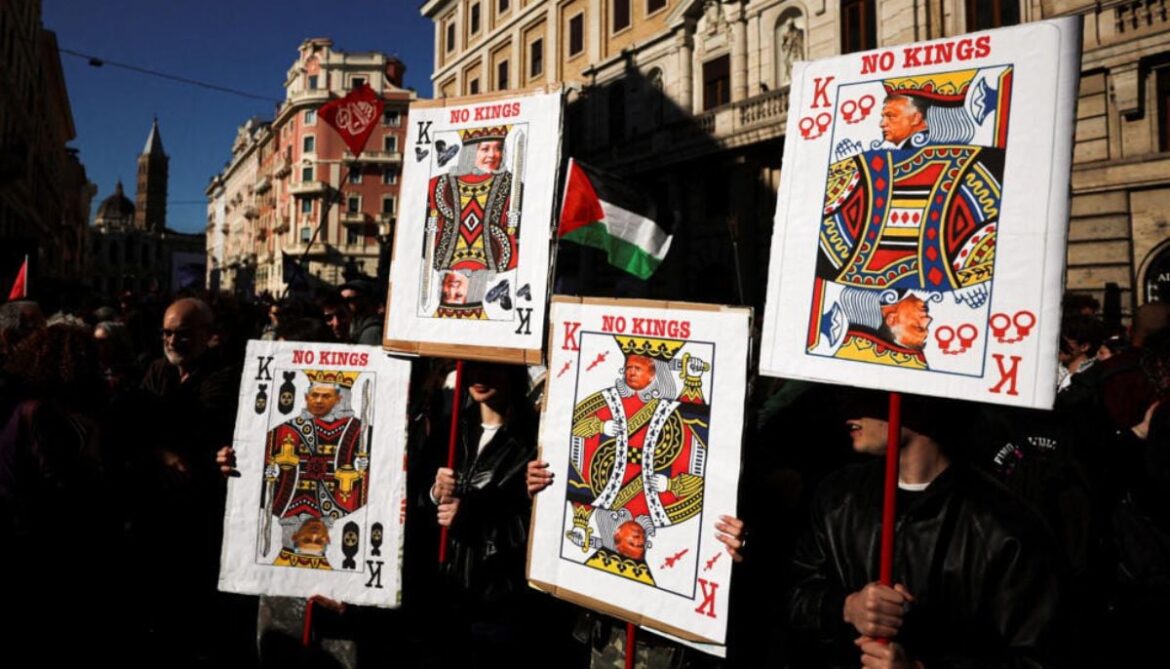 Protesters hold banners with playing card motifs during a nationwide No Kings demonstration, part of a coordinated international mobilisation, amid rising political tensions and following Prime Minister Giorgia Melonis recent defeat in the referendum, in Rome, Italy, March 28, 2026.