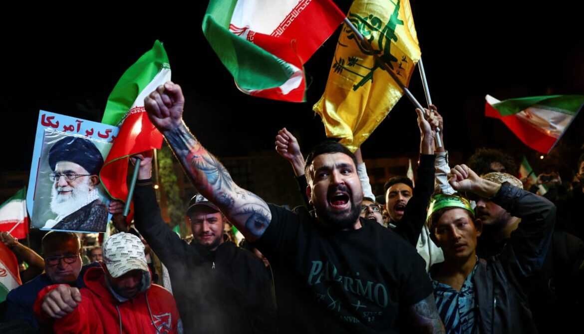 People shout slogans as they gather after a two-week ceasefire in the Iran war was announced, in Tehran, Iran, April 8, 2026. — Reuters