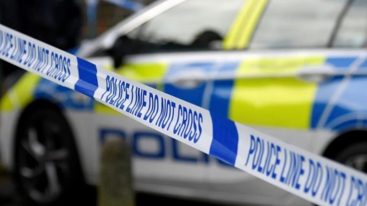 A representational image showing police vehicles and tape at a crime scene. — Reuters