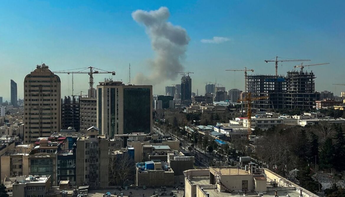A plume of smoke rises following a reported explosion in Tehran on February 28, 2026. — AFP