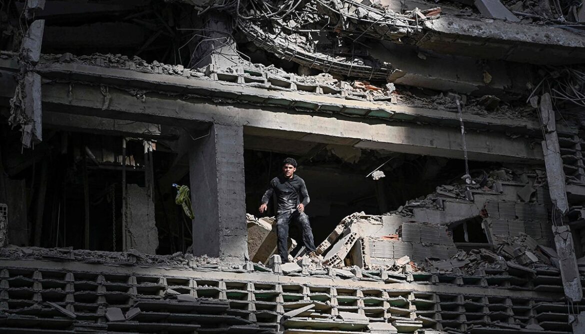 A man looks out from a damaged apartment building following an earthquake in Catia La Mar, La Guaira state, some 30km north-west of Caracas, on June 25, 2026. — AFP
