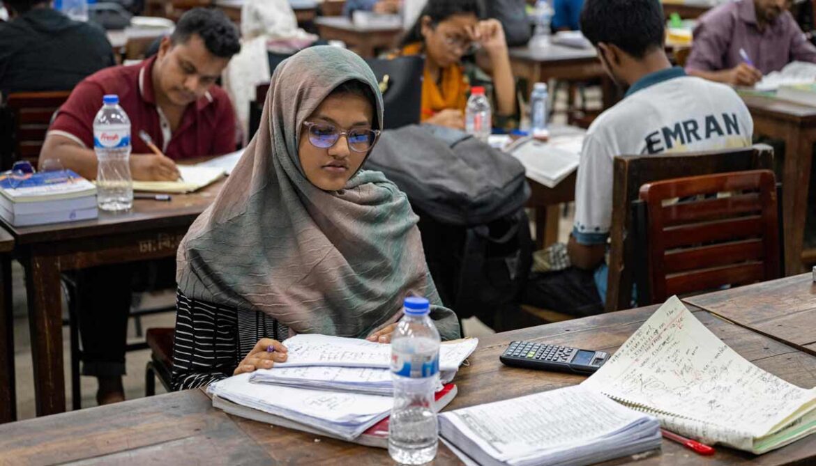 Image shows students studying inside the library at Dhaka University in Dhaka.— AFP